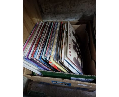 A box of over 80 assorted rock &amp; pop lps from the 80's to include Queen, Bryan Adams, Madonna, Gracee Jones, Level 42, Er