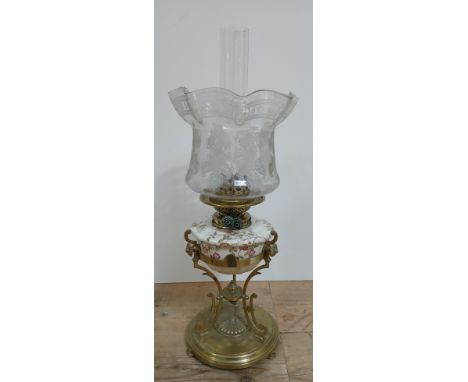 A Victorian brass oil lamp with pottery reservoir and etched glass shade, Young's Duplex fitting, weight brass base.