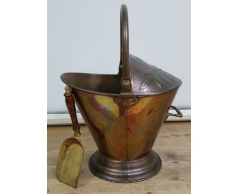 An Arts &amp; Crafts copper coal scuttle by Benham &amp; Froud, height 52cm, with associated shovel.