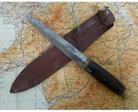 A WWII era fighting knife, the blade marked 'Southern &amp; Richardson' with leather sheather, together with a 1935 military 