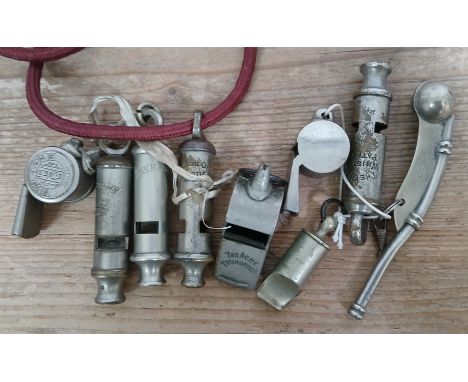A group of nine assorted whistles including ACME, Hudson, Bosuns with broad arrow marks.