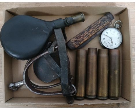 Assorted military including a WWII military pocket watch, shell cases, a knife, a shot flask and a pair of spurs.