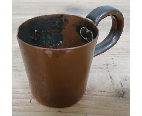 A Victorian Royal Navy copper grog measure, broad arrow to side, height 7cm.