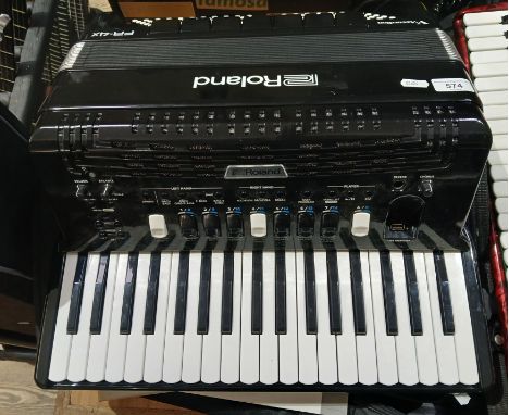 A Roland V-Accordion FR-4X electric accordion.Condition:- With power lead, with soft carry case, with reference & owners manu