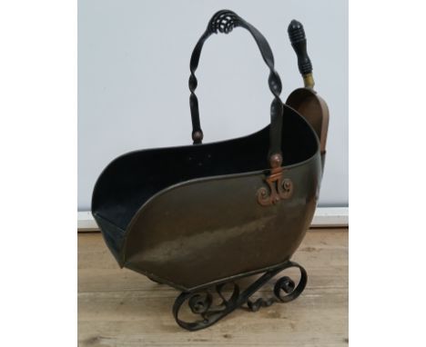 A wrought iron and copper coal scuttle, registered design number 127757, with associated shovel, height 55cm.