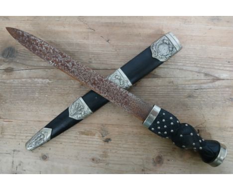A Scottish piper's dirk, carved hardwood and pique inlaid grip, silver plated pommel and leather scabbard with silver plated 