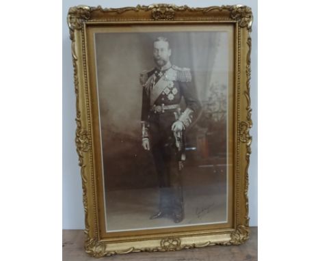 Prince George, later King George V, photographic portrait depicting the King in Royal Navy uniform, signed lower right, glaze