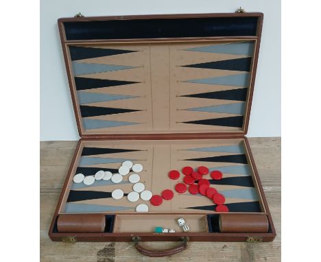 An Asprey of London backgammon set in leather case.Condition:- General wear through age & use, some light marks & scratches t