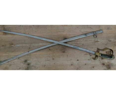 A dutch naval sabre, circa 1900, cast brass hilt and hand guard with lion pommel, wire bound celluloid handle, single fullere