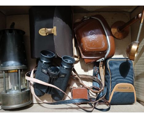 A pair of Carl Zeiss Dialyt 8x30B binoculars together with two cameras, a magnifier and a pit lamp.