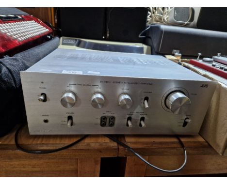 A JVC stereo integrated amplifier, model number JA-S11G.