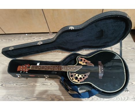 A Stagg EQ-505 electro-acoustic guitar with hard case.