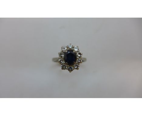 A hallmarked 18ct white gold diamond and sapphire ring size L, approx 3.8gs, head approx 11 x 10mm, some rubbing but reasonab