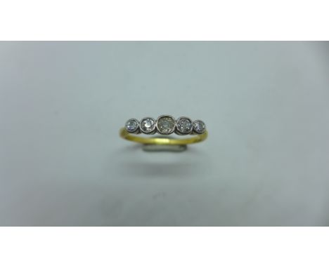 An 18ct gold and platinum 5 stone diamond ring, size O, approx 2.3 grams, hallmarked 18ct. Some usage but generally good cond