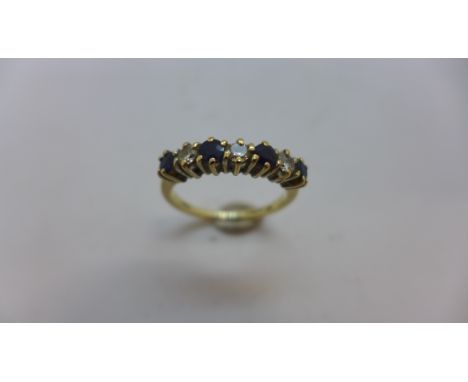 A hallmarked 9ct yellow gold diamond and sapphire seven stone ring size O, approx 2.7gs, generally good condition 