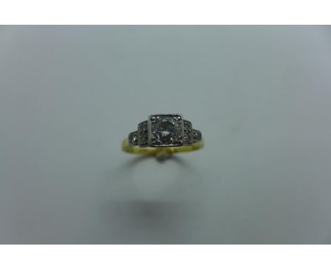 An 18ct and platinum diamond ring, the central stone approx 0.45ct, ring size N/O, approx 3.7 grams, some usage marks but dia