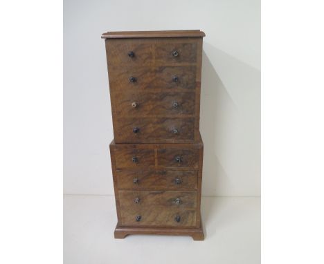 A Dunhill of London walnut presentation humidor pipe cabinet in the form of a chest on chest. 49cm tall, 23 x 17cm in good or