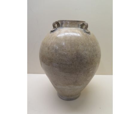 A Chinese Tang Dynasty jar decorated in a light crackle glaze 30 cm tall , condition - old chip to base otherwise generally g