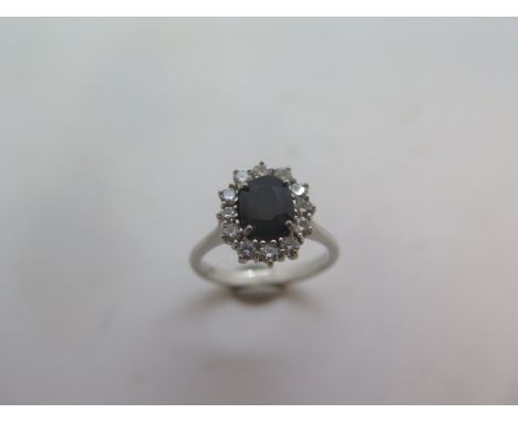 An 18ct white gold sapphire and white ring marked 18k, size M, approx 3.5gs. 