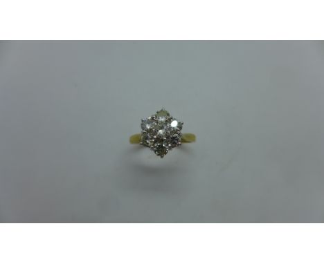 An 18ct yellow gold seven stone diamond daisy cluster ring - approx 1.15ct of diamonds - marked 18ct - ring size N - approx w