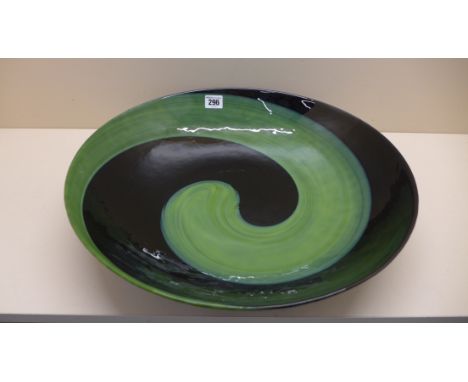 An impressive large murano glass dish decorated in jade green and black with a mottled under rim - initialled to base circa 1