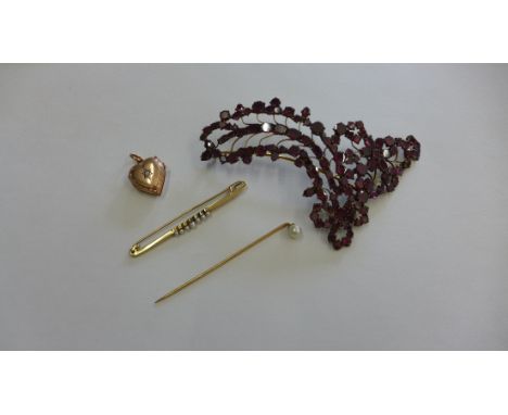 A gilt metal locket, stick pin and pearl brooch. No hallmarks, approx 6.9 grams and a dress brooch 