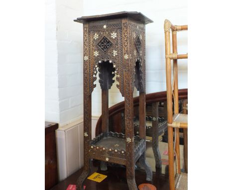 An Islamic Mother of Pearl inlaid carved plant stand
