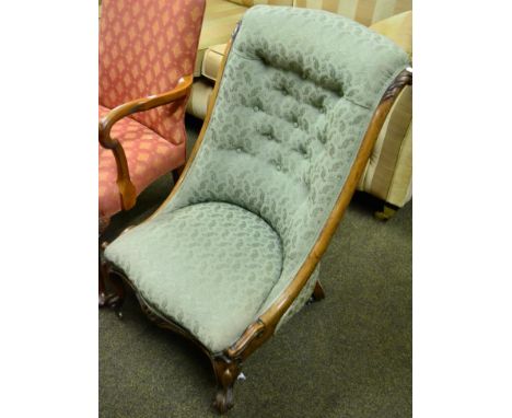 A Victorian walnut button back nursing chair 