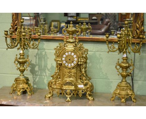 A reproduction gilt metal striking mantel clock garniture (a.f.)