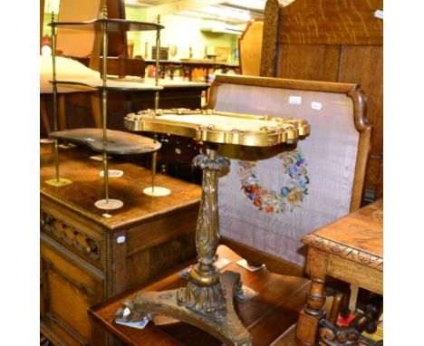 Victorian gilt and gesso tripod table adapted from a firescreen; an early 20th century French style kidney shaped whatnot; an