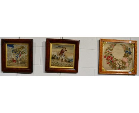 A tapestry panel of a floral swag; and two figural panels in matching rosewood frames (3)