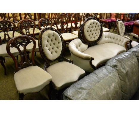 Victorian walnut framed seven piece drawing room suite comprising serpentine shaped sofa, armchair, nursing chair and four si