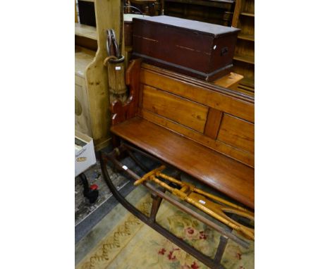 An early/mid 20th century sledge; a banded stick stand; a boot bull; and a silver mounted umbrella 