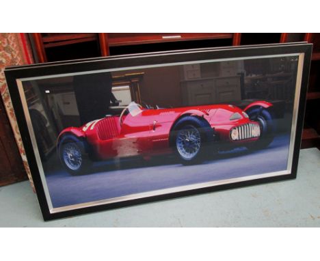PRINT, of a red racing car within a glazed frame, 92cm x 172cm. 