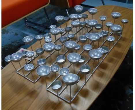 NIGHT LIGHT HOLDERS, a set of three, in metal, each holding three night lights, 60cm L. (3)