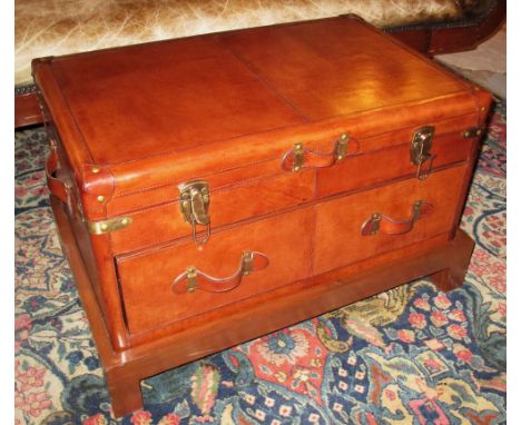 LEATHER TRUNK, Ralph Lauren style tan leather with a rising top over a single drawer on a wooden stand, 76cm W x 45cm H x 45c