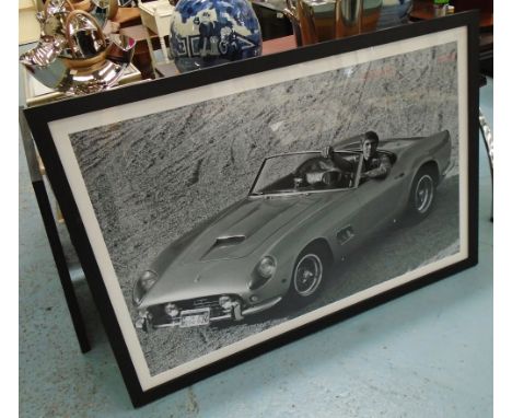'JAMES COBURN WITH FERRARI', photo print, 115cm L x 73cm, framed. 