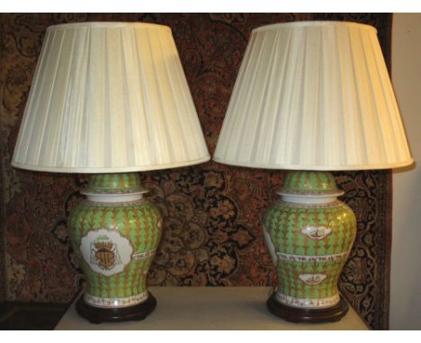 TABLE LAMPS, a pair, Chinese famille verte ceramic with armorial detail and cream shades, 72cm H x 50cm. (2)