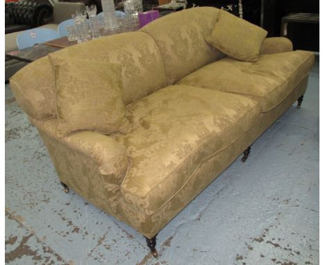 GEORGE SMITH SOFA, two seater, in a light olive fabric floral design on turned castor supports with a pair of scatter cushion