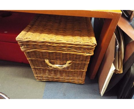 A large wicker linen hamper
