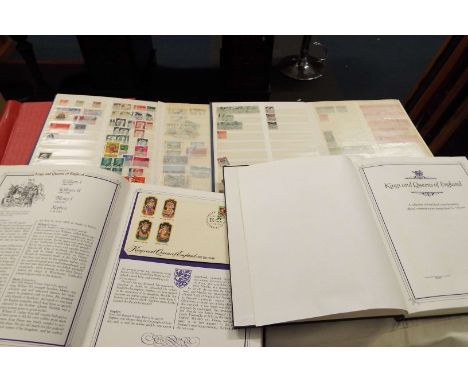 Four assorted albums containing stamps of the World and first day covers and one other