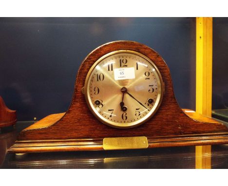 An oak cased mantle clock having Arabic numerals eight day movement and Westminster chime