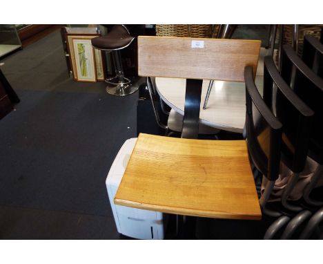 A beech and chrome bar stool
