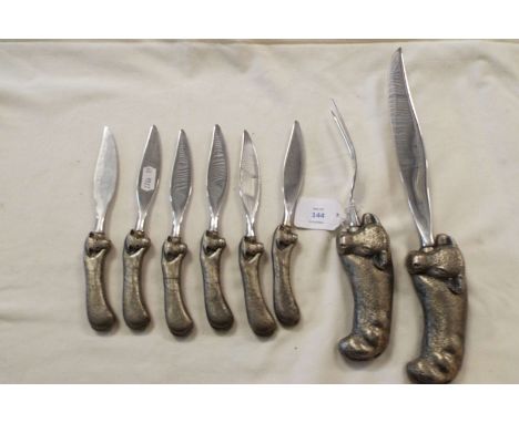 An Atco Fleetwood Designer set of carving knife and fork, along with six steak knives having pewter bull/steer head handles