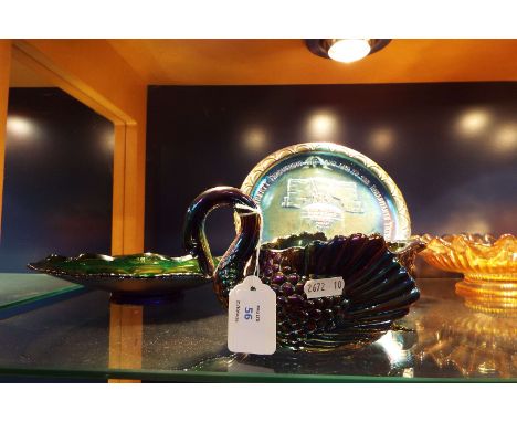 A carnival lustre glass swan, two plates and a plate decorated with the 'Liberty Bell'