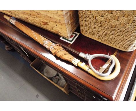 A shooting stick and umbrella 