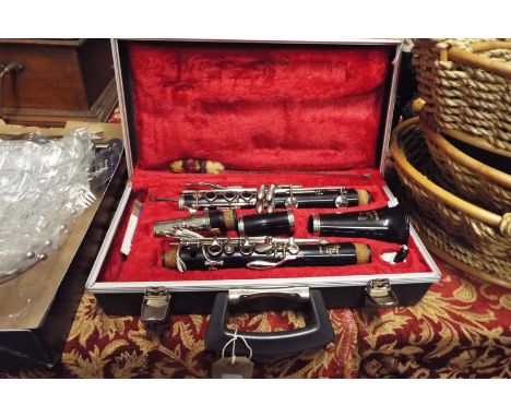 A Boosey & Hawkes ebonised clarinet in original hard case