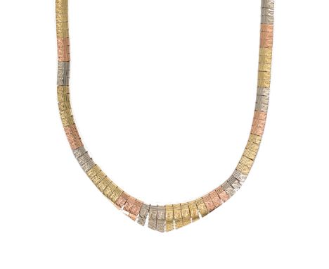 A modern three colour gold 'Cleopatra' style fringe necklet, each link engine turned with diamond cut decoration and graduati
