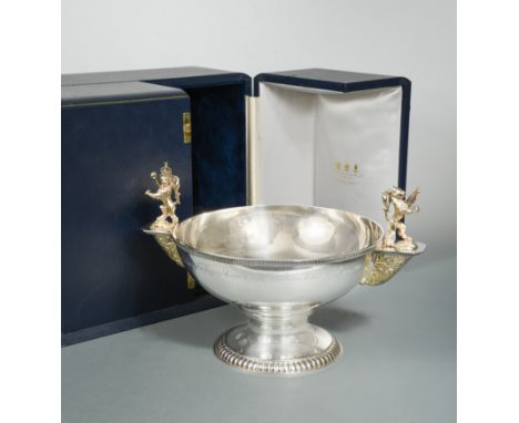 A 20th century parcel gilt silver commemorative bowl, mark of Garrard &amp; Co., London 1990, of circular form with gadrooned