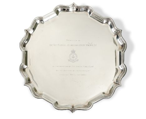 A 20th century silver presentation salver, mark of Garrard &amp; Co, London 1962, of 'Chippendale' style, the field engraved,